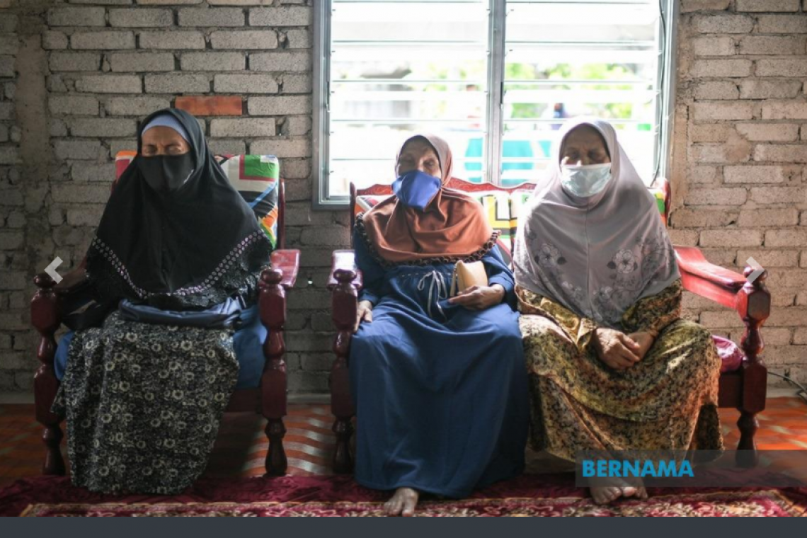 Visually impaired elderly sisters receive special visit from minister